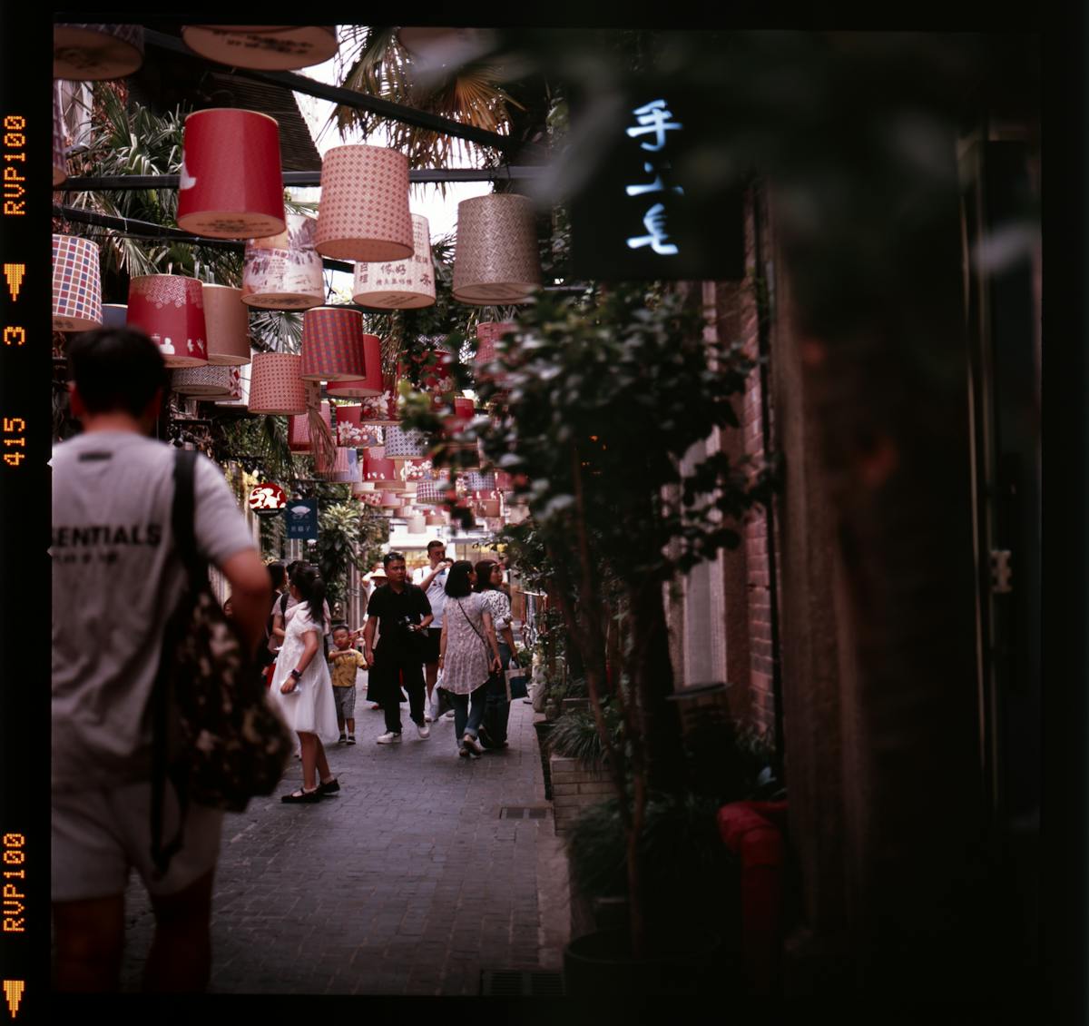 A narrow shikumen lane in Tianzifang lined with small shops and cafes