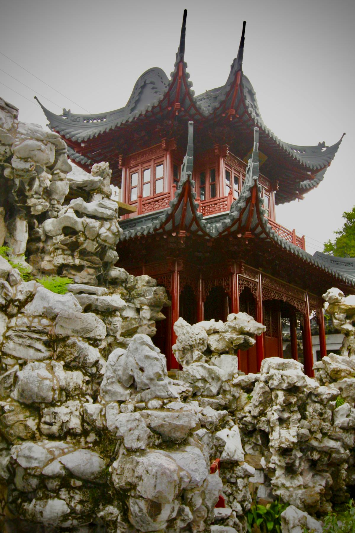 The lattice-walled pavilions and pond of Yu Garden in Shanghai's Old Town